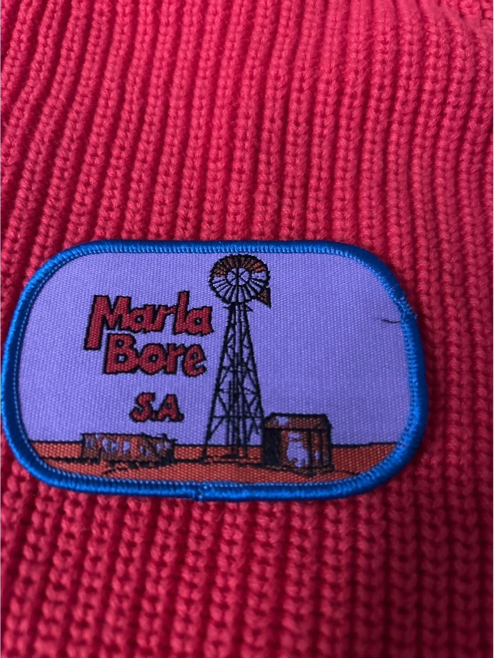 Marla Bore S.A. Embroidered Patch with Windmill Design